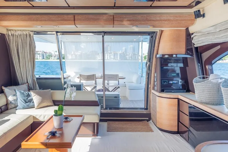 Slide: The Image of Luxurious interior of 2012 Azimut Evolution yacht with elegant seating and scenic ocean view. - 56