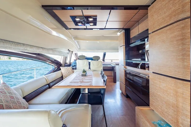 Slide: The Image of Luxurious interior of 2012 Azimut Evolution yacht with elegant seating and dining area. - 57