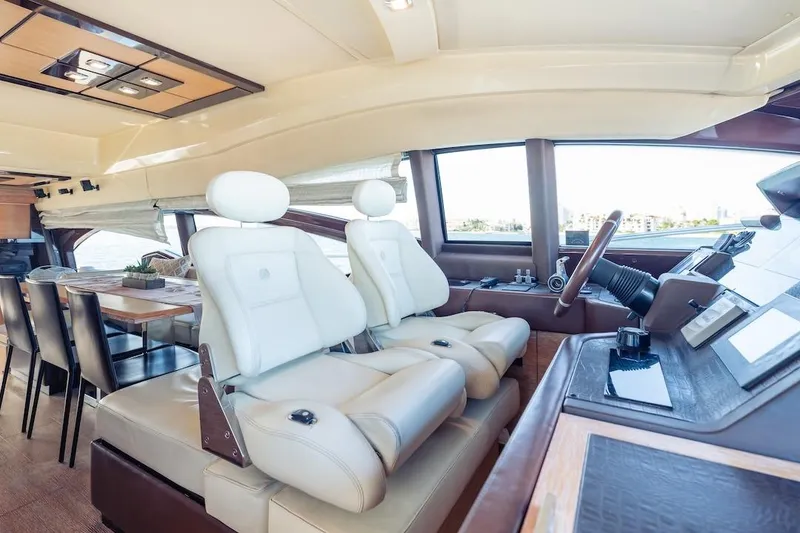 Slide: The Image of Luxurious interior of 2012 Azimut Evolution yacht with leather seating and modern helm. - 61