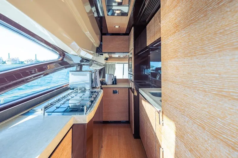 Slide: The Image of Luxurious kitchen interior of 2012 Azimut Evolution yacht with modern appliances and wood finishes. - 64