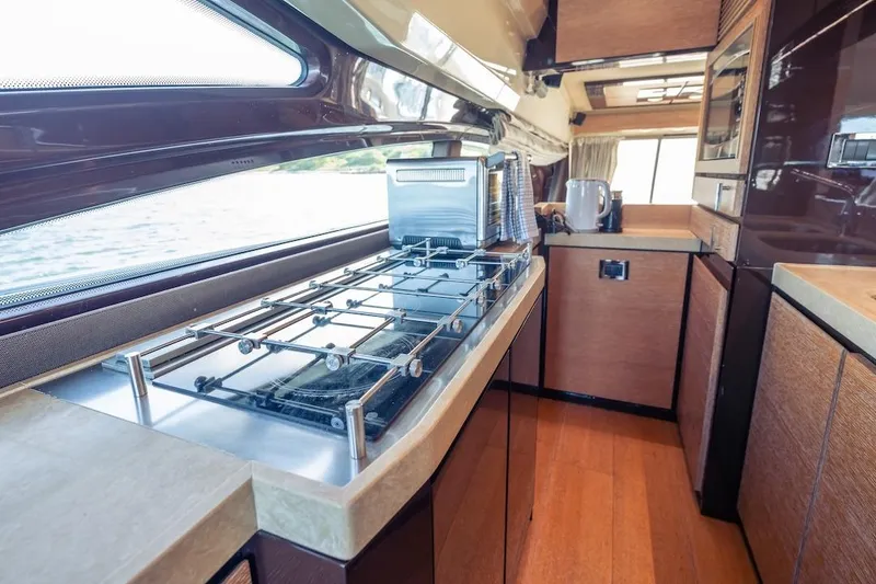 Slide: The Image of Luxurious kitchen interior of 2012 Azimut Evolution yacht with modern appliances and sleek design. - 67