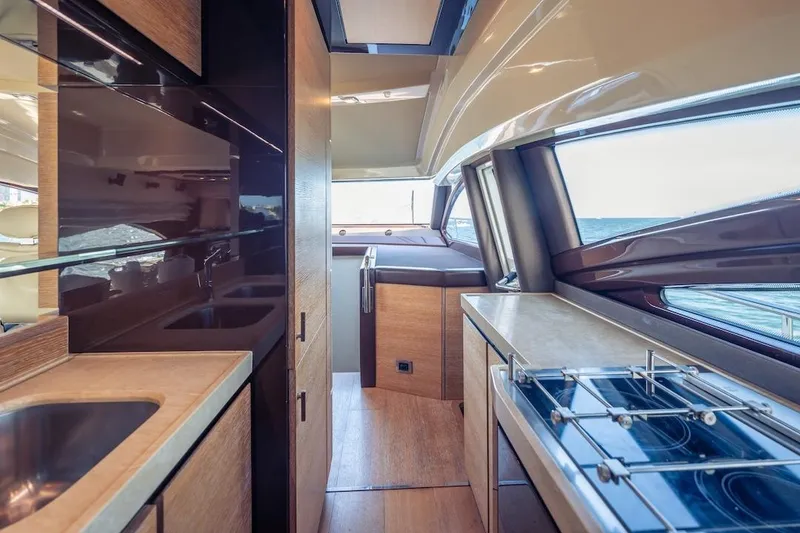 Slide: The Image of Luxurious interior of 2012 Azimut Evolution yacht with modern kitchen and ocean view. - 68
