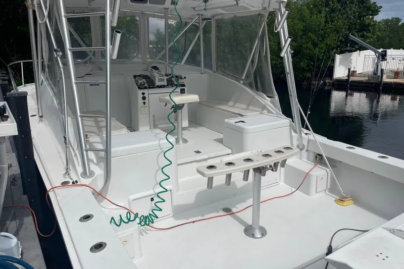 Slide: The Image of 1994 Luhrs 32 Open boat with spacious deck and fishing rod holders. - 3