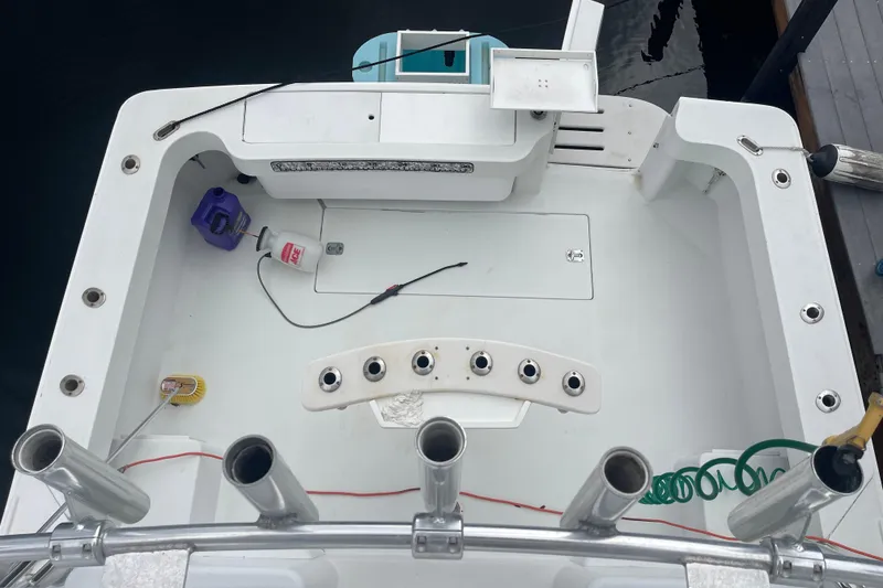 Slide: The Image of 1994 Luhrs 32 Open boat deck with fishing rod holders and equipment. - 4