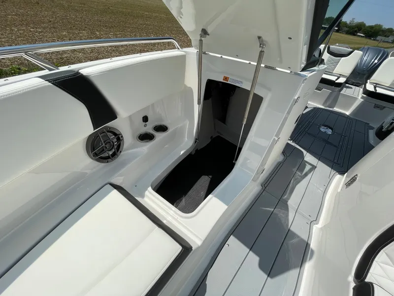 Slide: The Image of 2024 Chaparral 250 OSX boat interior with speaker and cup holders. - 12