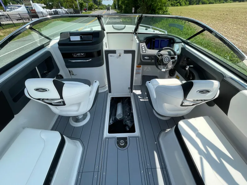 Slide: The Image of 2024 Chaparral 250 OSX boat interior with seating and steering console. - 42