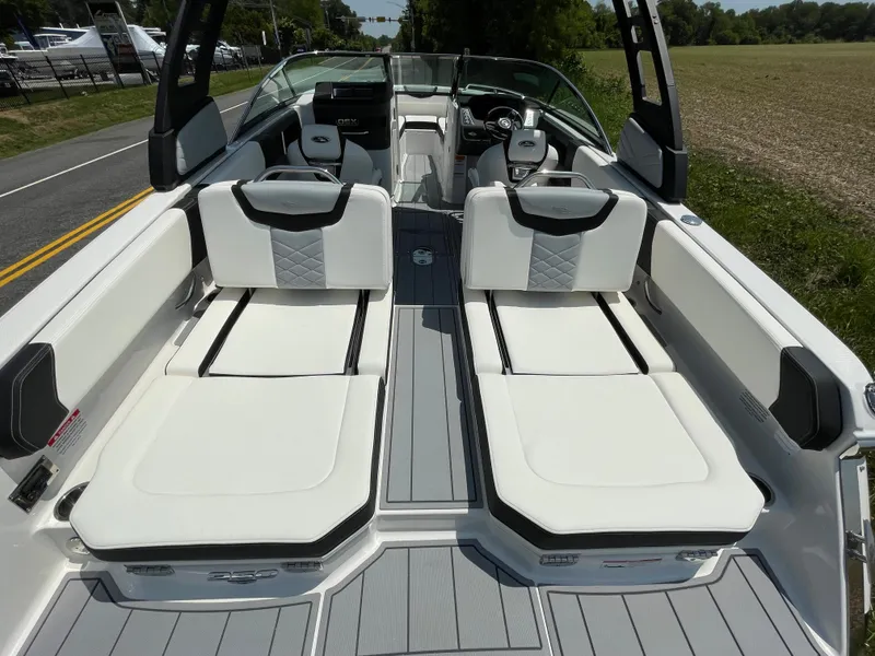 Slide: The Image of 2024 Chaparral 250 OSX boat interior with seating and control panel. - 46