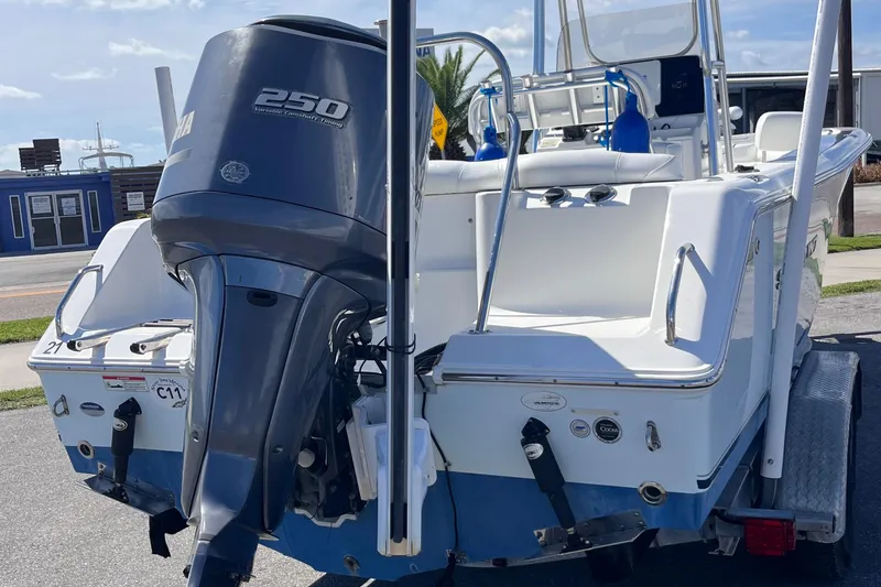 Slide: The Image of 2015 Sea Hunt Ultra 234 boat with Yamaha 250 engine, parked on a trailer. - 19