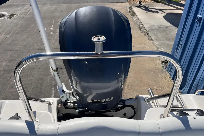 Slide: The Image of 2015 Sea Hunt Ultra 234 boat with Yamaha 250 engine, docked outdoors. - 20