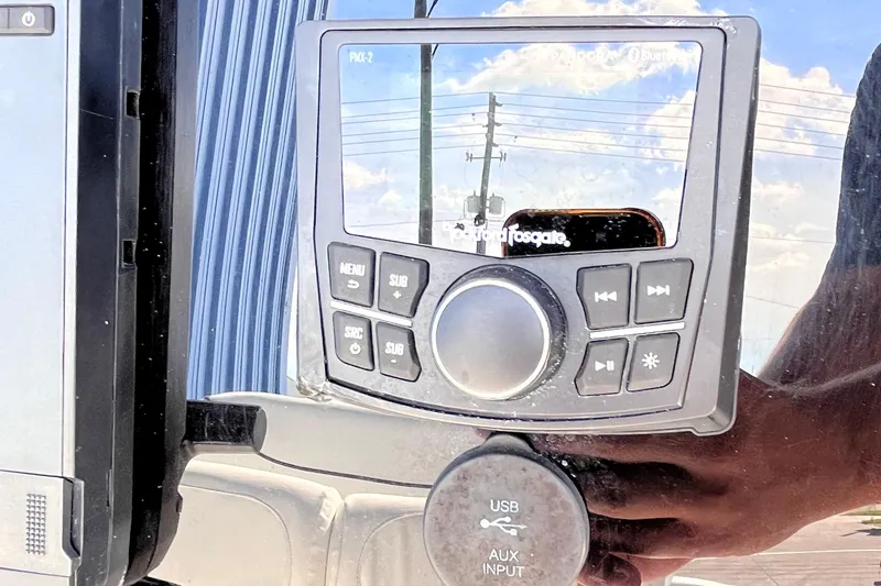 Slide: The Image of Control panel on 2015 Sea Hunt Ultra 234 boat with USB and AUX input. - 9