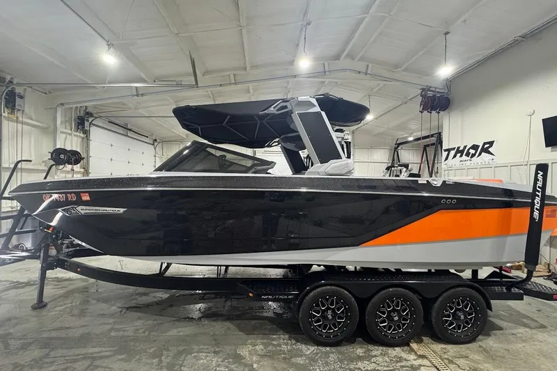 Slide: The Image of 2022 Nautique Super Air Nautique G25 interior with stylish seating and modern design. - 1