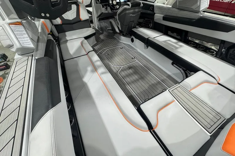 Slide: The Image of 2022 Nautique Super Air Nautique G25 interior with sleek seating and modern design. - 12