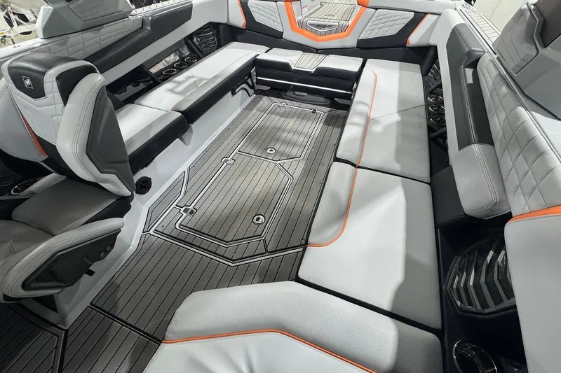 Slide: The Image of 2022 Nautique Super Air Nautique G25 boat on trailer in showroom. - 14