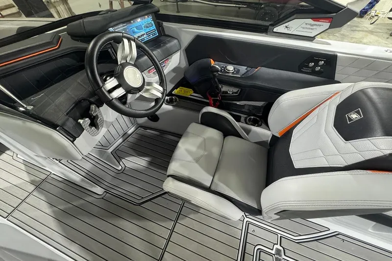 Slide: The Image of 2022 Nautique Super Air Nautique G25 boat rear view with exhaust and platform. - 15