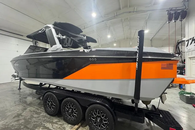 Slide: The Image of 2022 Nautique Super Air Nautique G25 interior with sleek seating and modern design. - 2