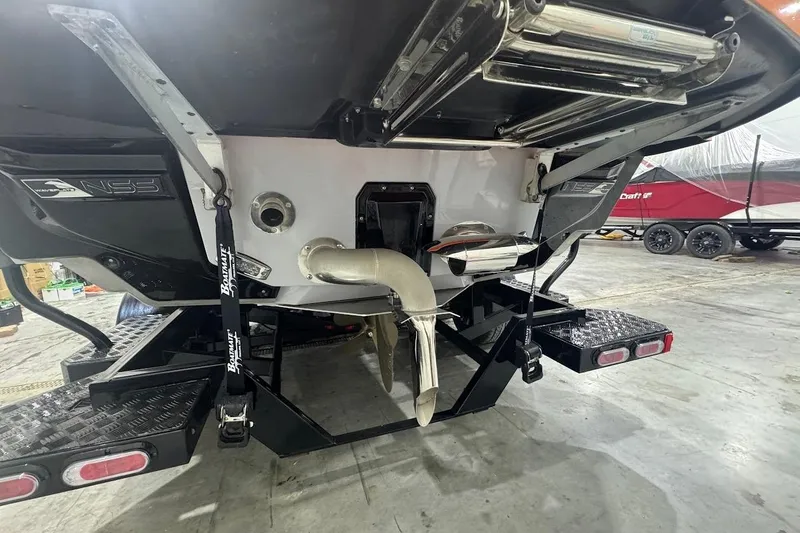 Slide: The Image of 2022 Nautique Super Air Nautique G25 interior with speaker and sleek flooring design. - 3