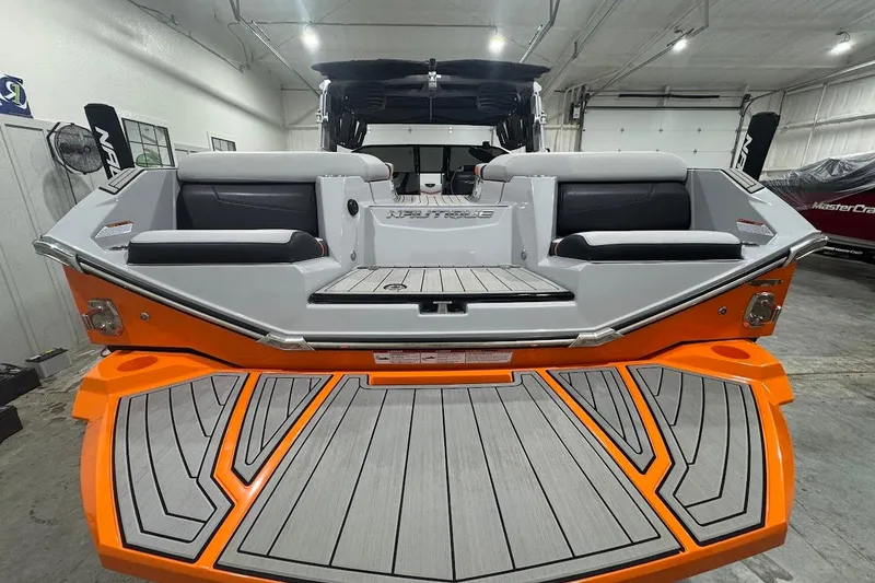 Slide: The Image of 2022 Nautique Super Air Nautique G25 interior with gray and orange upholstery. - 4