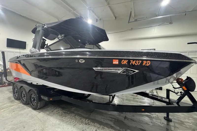 Slide: The Image of 2022 Nautique Super Air Nautique G25 boat interior with stylish seating and modern design. - 7