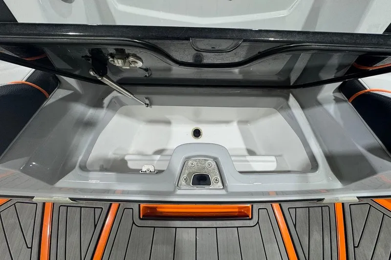 Slide: The Image of 2022 Nautique Super Air Nautique G25 boat interior with modern steering and controls. - 8