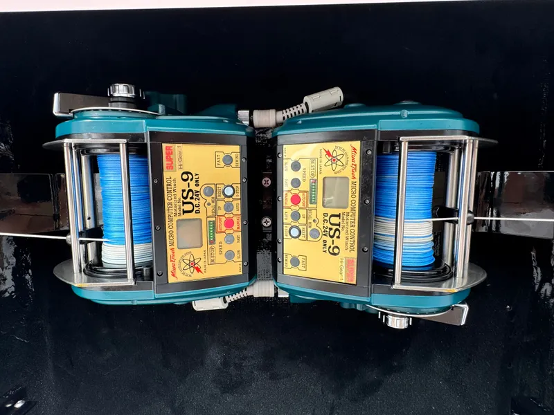 Slide: The Image of Electric fishing reels with blue line on a 2021 Albemarle 41 Express boat. - 14