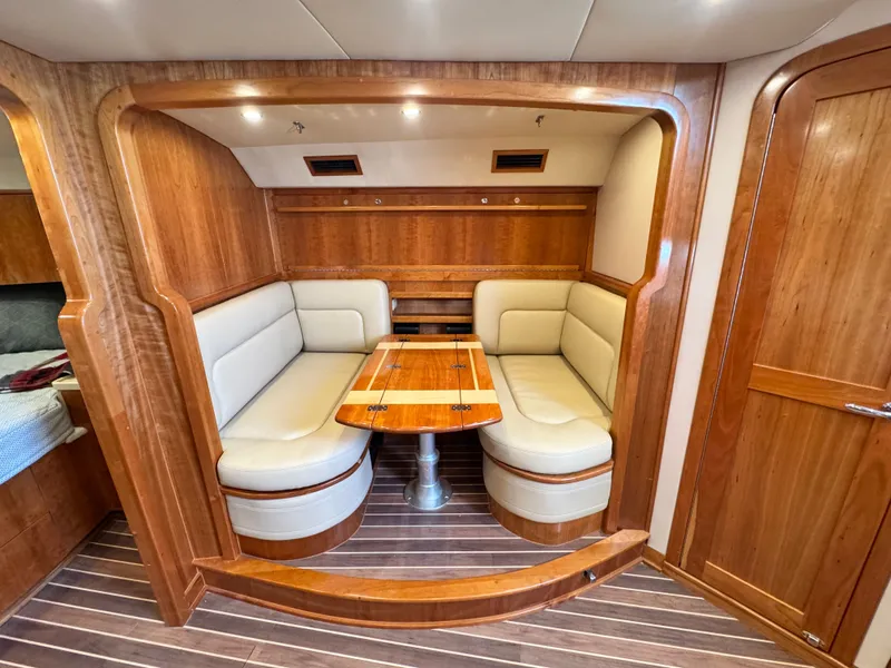 Slide: The Image of Luxurious 2021 Albemarle 41 Express yacht interior with elegant wood finish and cozy seating area. - 19
