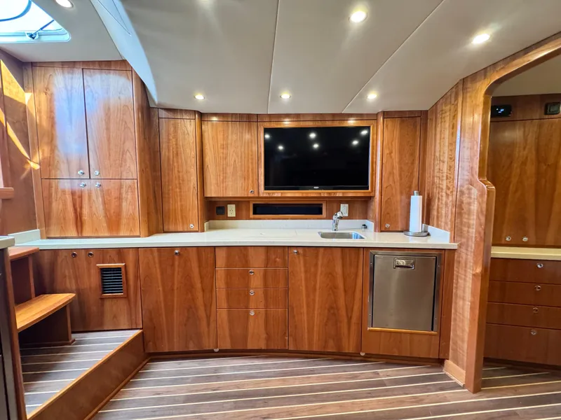 Slide: The Image of Luxurious 2021 Albemarle 41 Express yacht interior with wood cabinetry and modern amenities. - 20