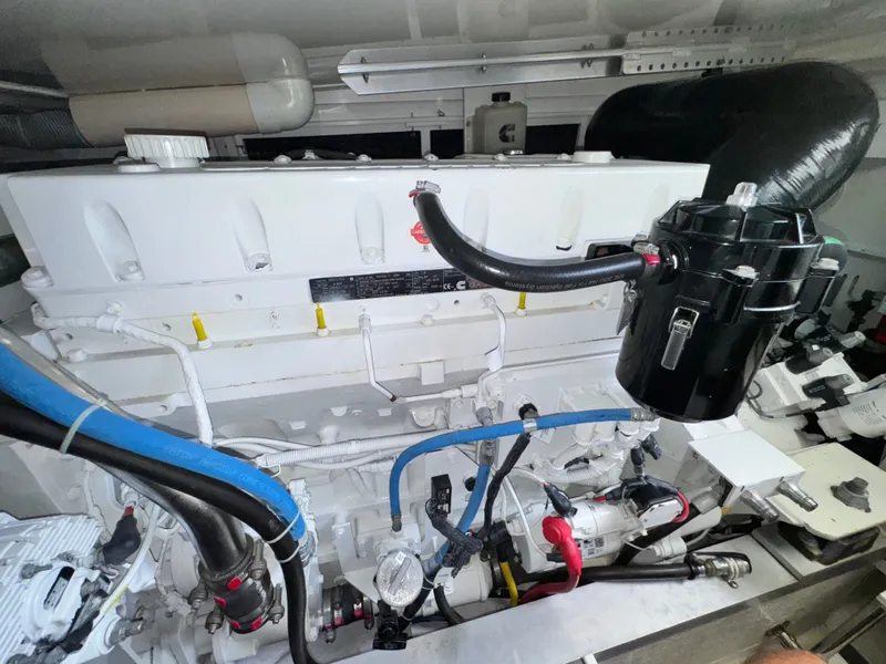 Slide: The Image of Engine room of 2021 Albemarle 41 Express boat, showcasing complex machinery and components. - 26