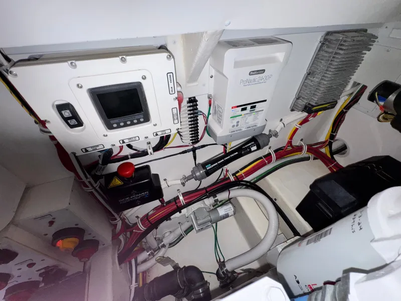 Slide: The Image of Engine room of 2021 Albemarle 41 Express with electrical components and wiring. - 29