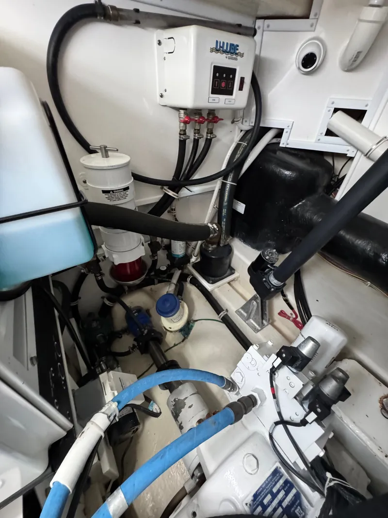 Slide: The Image of Engine room of 2021 Albemarle 41 Express with various mechanical components and wiring. - 31