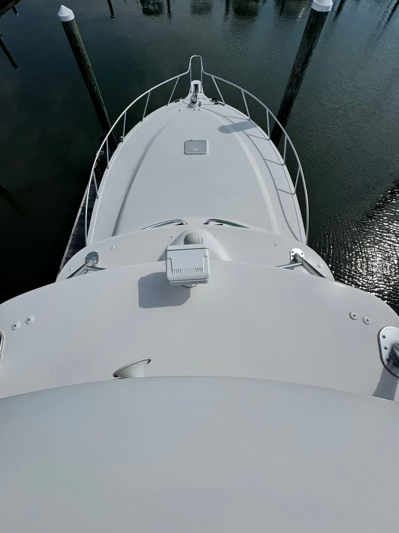 Slide: The Image of 2021 Albemarle 41 Express yacht bow view at marina. - 32