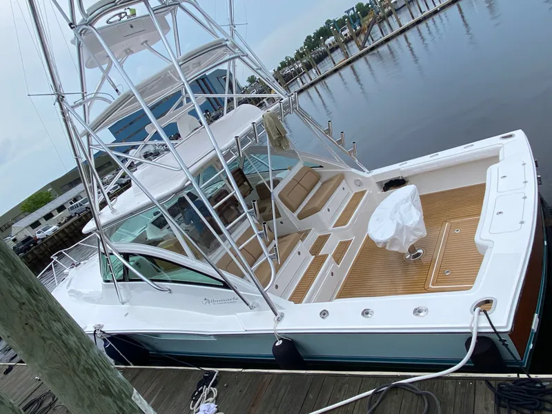 Slide: The Image of 2021 Albemarle 41 Express boat docked, featuring spacious deck and sleek design. - 33