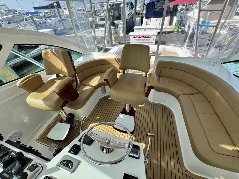 Slide: The Image of Luxurious interior of 2021 Albemarle 41 Express yacht with tan leather seating and modern controls. - 7