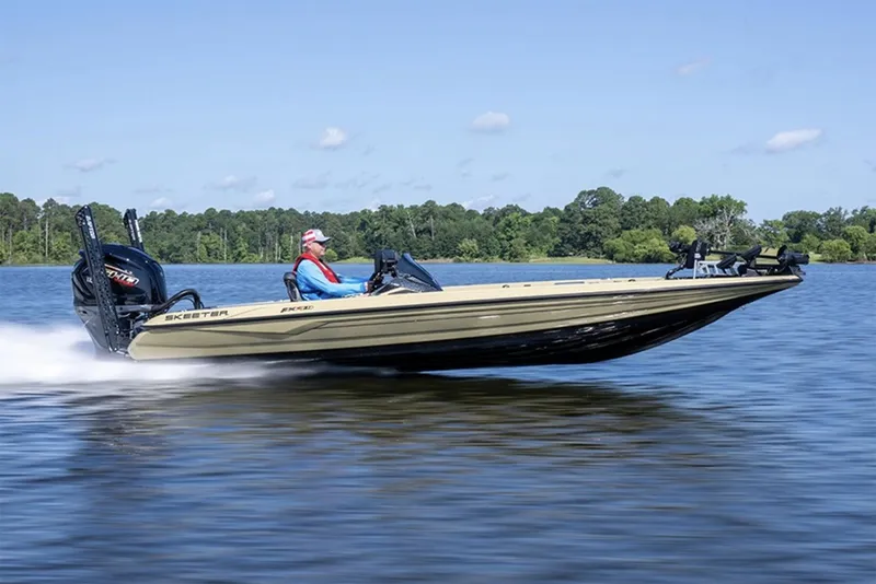 Slide: The Image of Manufacturer Provided Image: 2026 Skeeter FXR21 Apex boat speeding on a lake with a driver. - 13