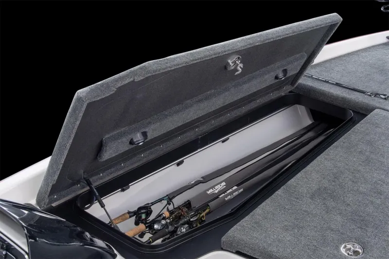 Slide: The Image of Manufacturer Provided Image: 2026 Skeeter FXR21 Apex boat storage compartment with fishing rods inside. - 17