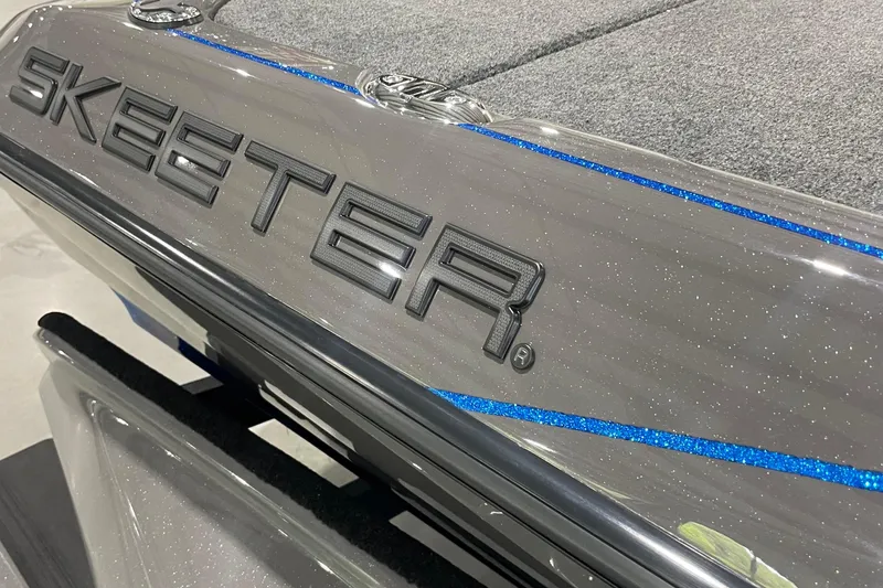 Slide: The Image of 2026 Skeeter FXR21 Apex boat with sleek design and blue accents. - 4