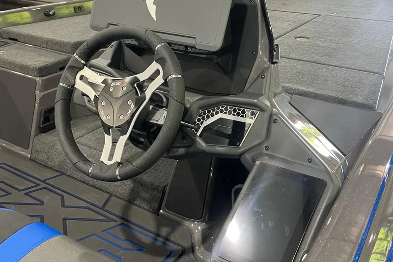 Slide: The Image of 2026 Skeeter FXR21 Apex boat cockpit with modern steering wheel and dashboard design. - 6