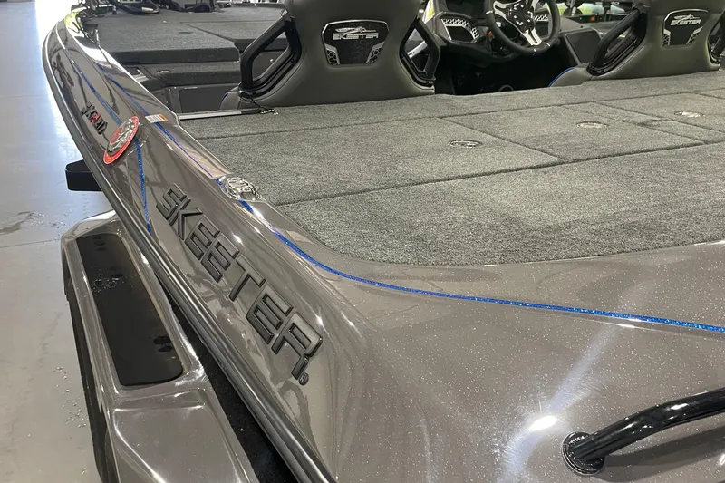 Slide: The Image of 2026 Skeeter FXR21 Apex boat interior with sleek design and spacious deck. - 9