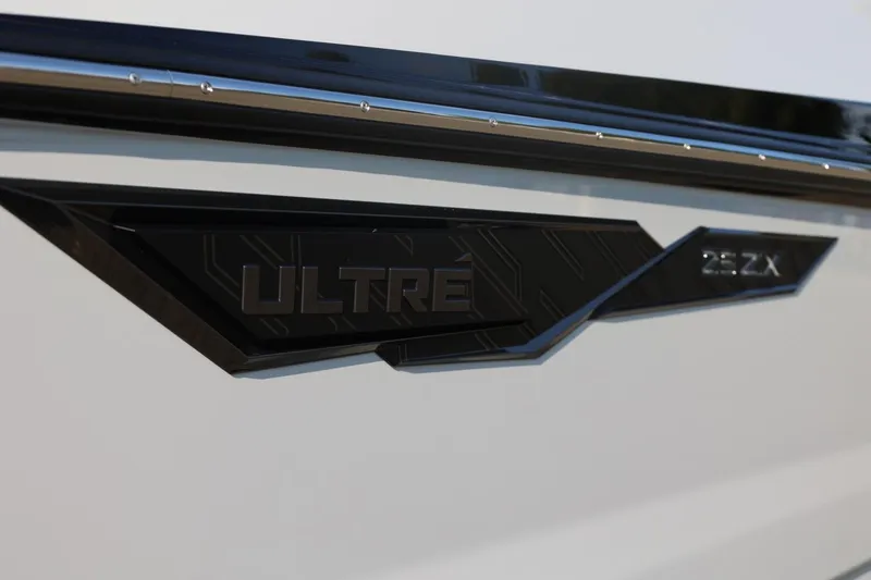Slide: The Image of 2026 Tigé Ultré 25ZX logo on sleek boat exterior. - 12