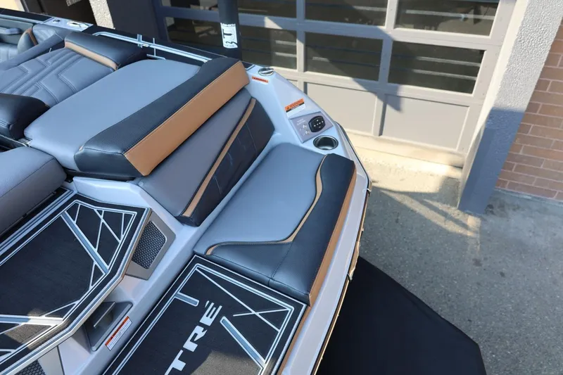 Slide: The Image of 2026 Tigé Ultré 25ZX boat interior with sleek seating and modern design. - 14