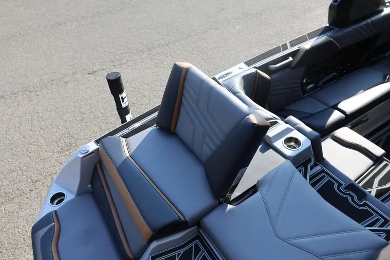 Slide: The Image of 2026 Tigé Ultré 25ZX boat interior with stylish seating and cup holders. - 21