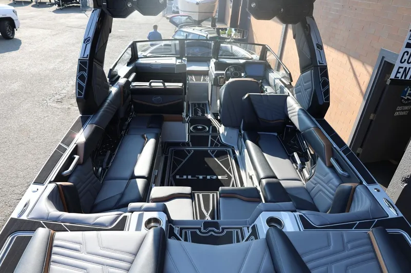Slide: The Image of 2026 Tigé Ultré 25ZX boat interior with luxurious seating and modern design. - 24