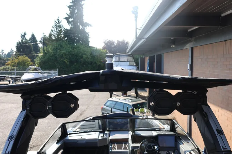 Slide: The Image of 2026 Tigé Ultré 25ZX boat with advanced audio system and sleek design. - 25