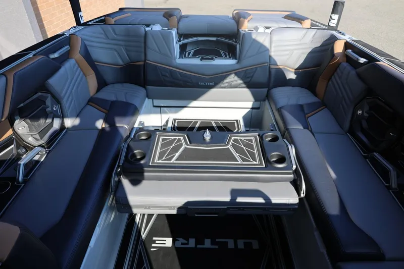 Slide: The Image of Luxurious interior of 2026 Tigé Ultré 25ZX boat with stylish seating and table. - 28