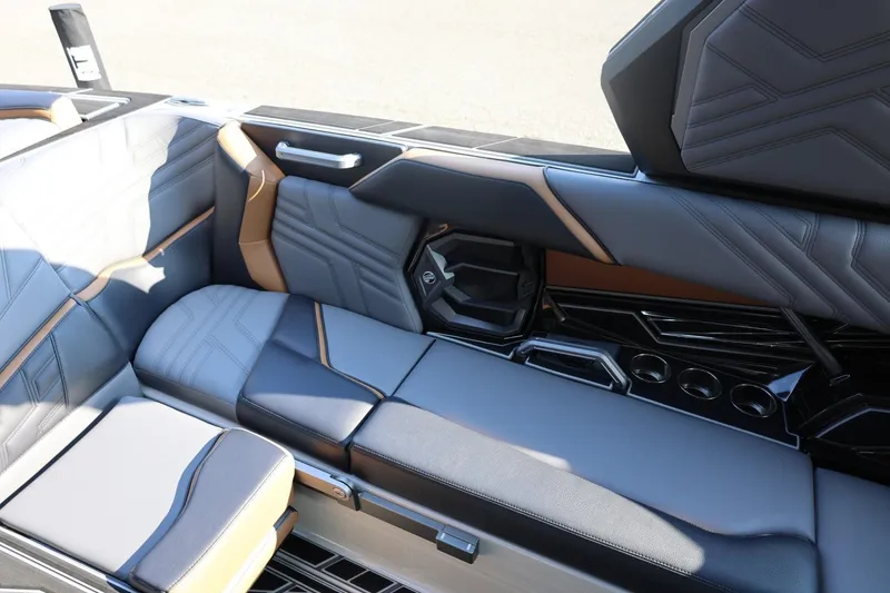 Slide: The Image of Luxurious interior seating of 2026 Tigé Ultré 25ZX boat with sleek design and cup holders. - 31