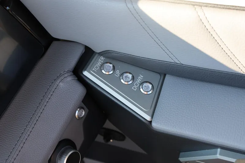 Slide: The Image of Control panel in 2026 Tigé Ultré 25ZX boat, featuring tower adjustment buttons. - 44