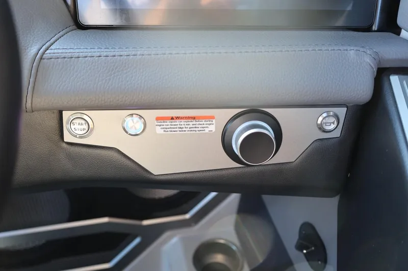 Slide: The Image of 2026 Tigé Ultré 25ZX dashboard with start/stop button and control knob. - 48