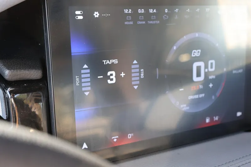 Slide: The Image of Dashboard display of 2026 Tigé Ultré 25ZX boat showing speed and control settings. - 53