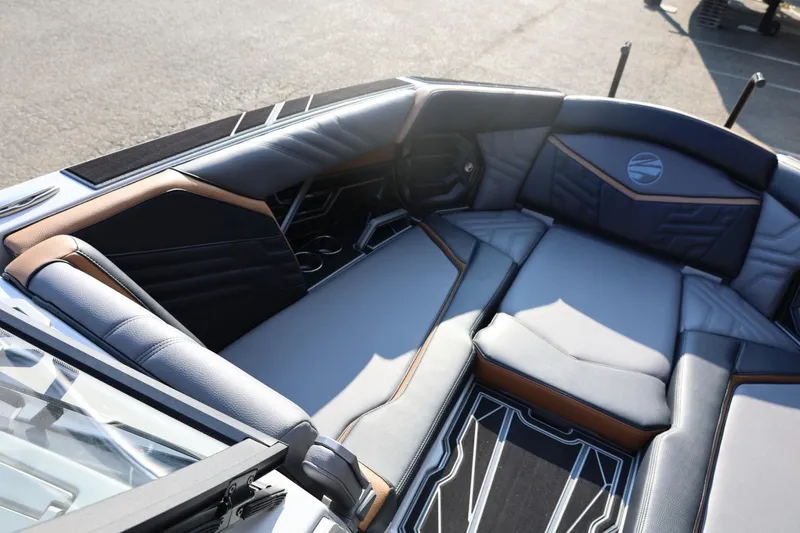 Slide: The Image of 2026 Tigé Ultré 25ZX boat interior with luxurious seating and modern design. - 56
