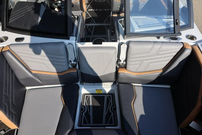 Slide: The Image of Interior seating of 2026 Tigé Ultré 25ZX boat with sleek, modern design. - 61