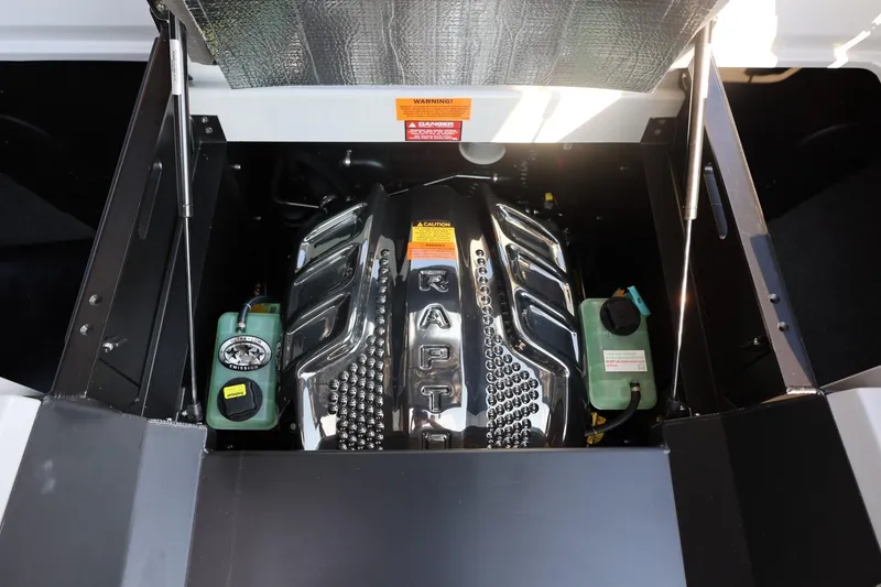 Slide: The Image of Engine compartment of 2026 Tigé Ultré 25ZX boat, showcasing powerful motor components. - 66